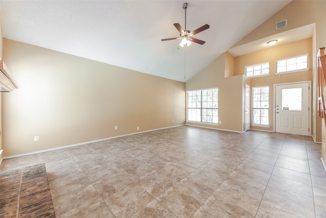 unfurnished living room with high vaulted ceiling, ceiling fan, and light tile patterned flooring