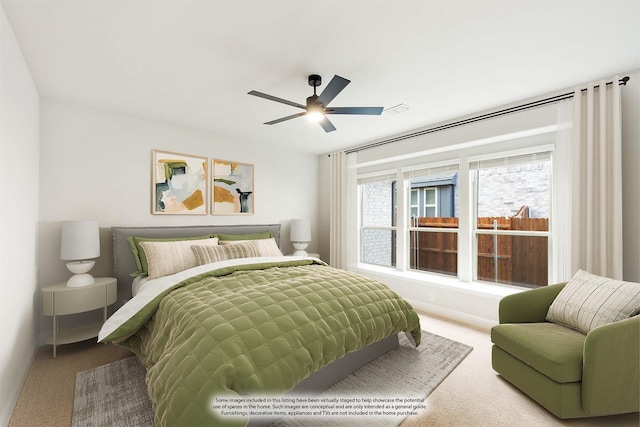 bedroom featuring ceiling fan and carpet floors