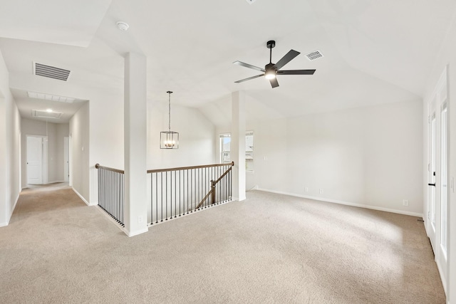 spare room with light colored carpet, ceiling fan, and lofted ceiling