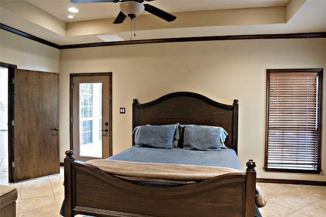 7226 County Road 1504, Athens, TX 75751 - bedroom featuring light tile patterned flooring, a tray ceiling, crown molding, baseboards, and a ceiling fan