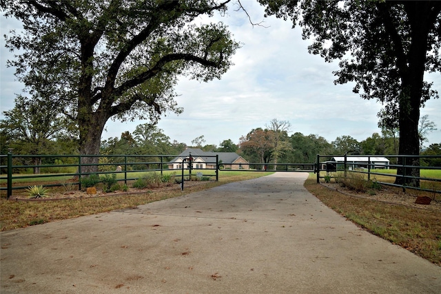 7226 County Road 1504, Athens, TX 75751 - view of concrete driveway featuring a gated entry