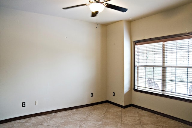 7226 County Road 1504, Athens, TX 75751 - empty room featuring plenty of natural light, a ceiling fan, and baseboards