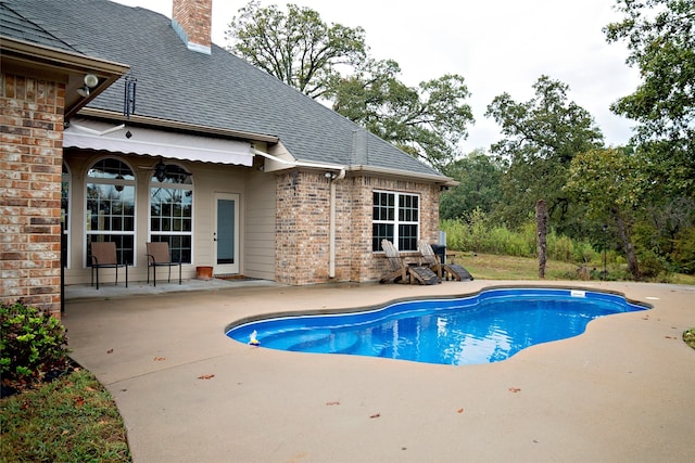 view of pool featuring a patio