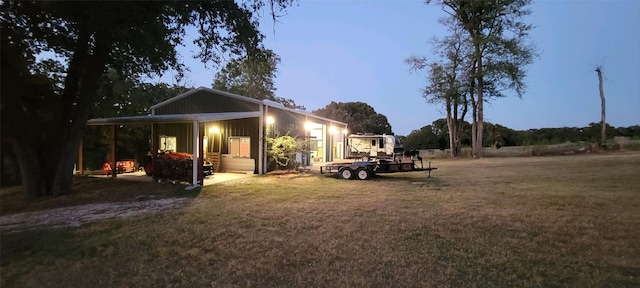 7226 County Road 1504, Athens, TX 75751 - back of property with a yard and board and batten siding