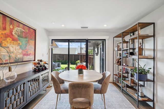 dining room with hardwood / wood-style floors