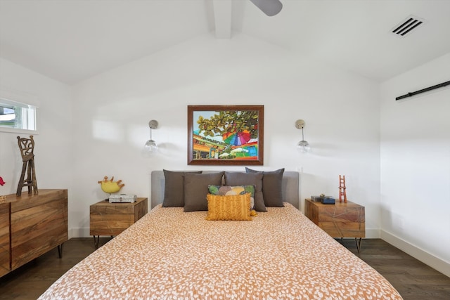 bedroom featuring a barn door, vaulted ceiling with beams, dark hardwood / wood-style floors, and ceiling fan