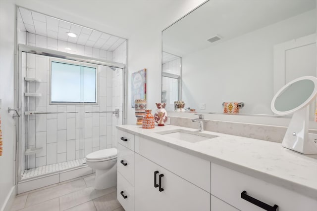 bathroom featuring walk in shower, tile patterned flooring, vanity, and toilet