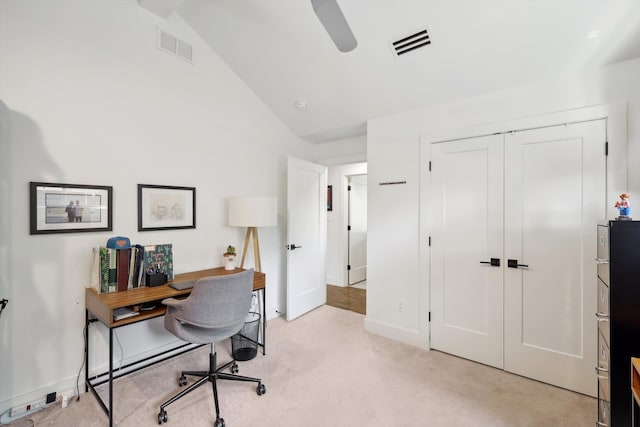 office area featuring light carpet, lofted ceiling, and ceiling fan