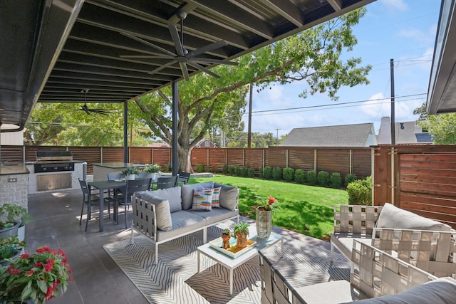 view of patio / terrace featuring grilling area, an outdoor living space, and exterior kitchen