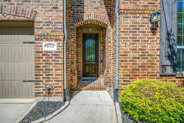 entrance to property featuring a garage