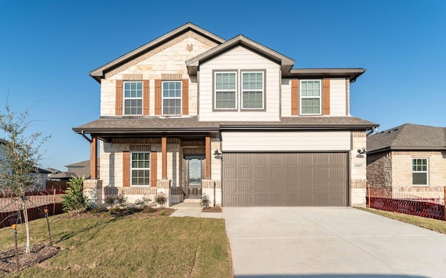 view of front of property featuring a garage and a front yard