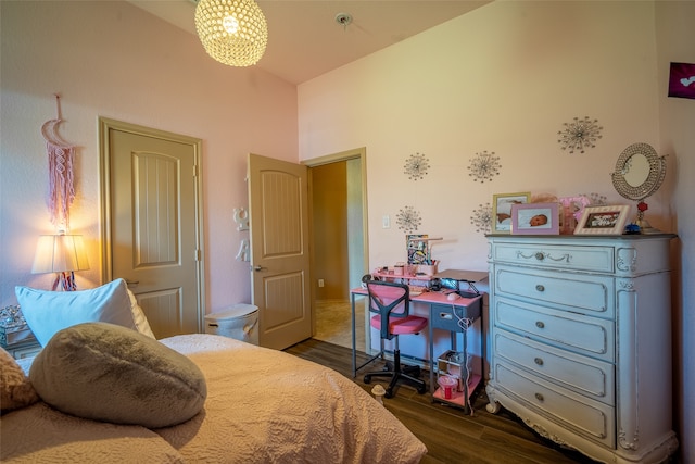 bedroom with dark wood-type flooring