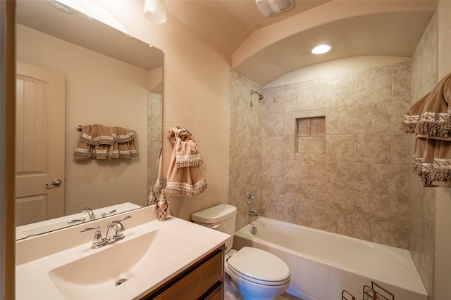 full bathroom with vanity, toilet, and tiled shower / bath