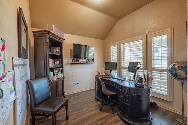 office with vaulted ceiling and dark hardwood / wood-style flooring