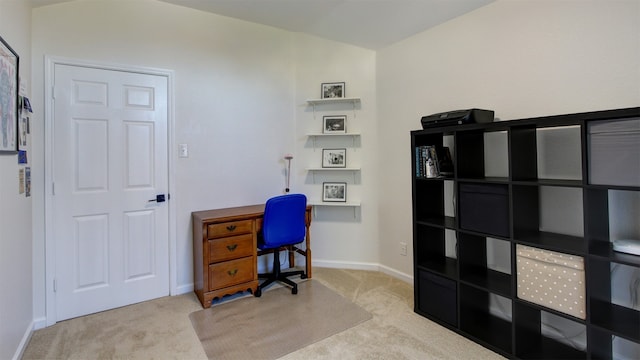 office area featuring light carpet