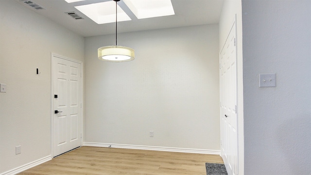 unfurnished room with light wood-type flooring