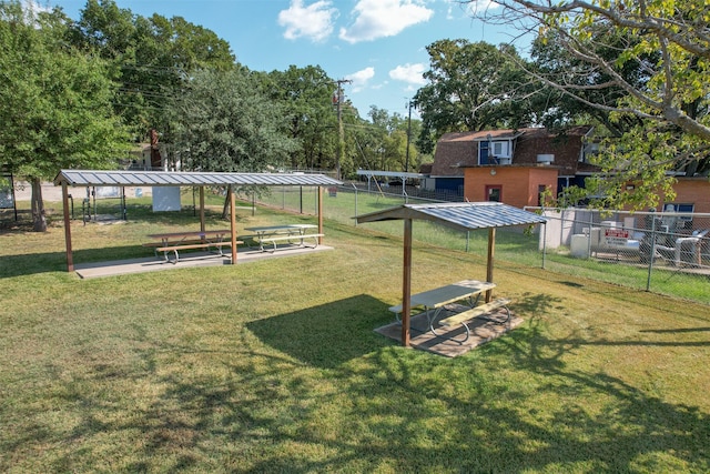 view of home's community with a lawn