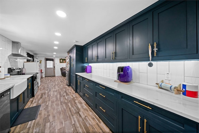 kitchen with tasteful backsplash, wall chimney exhaust hood, stainless steel range with electric stovetop, dishwasher, and light hardwood / wood-style flooring