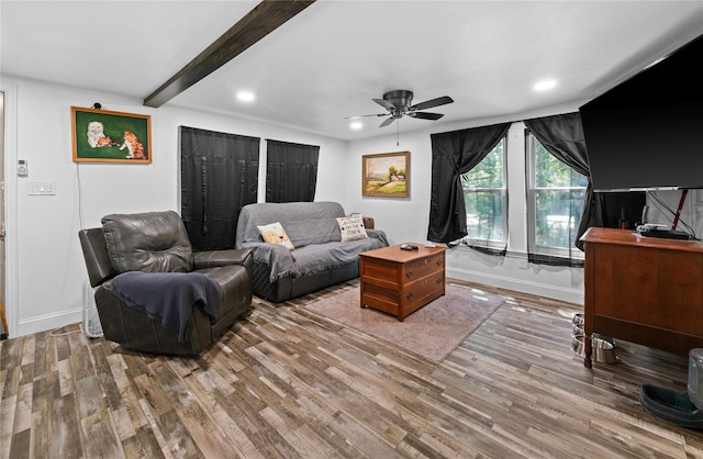 living room with beam ceiling, ceiling fan, and hardwood / wood-style floors