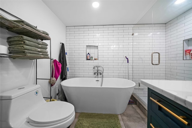 full bathroom featuring vanity, plus walk in shower, tile patterned floors, tile walls, and toilet