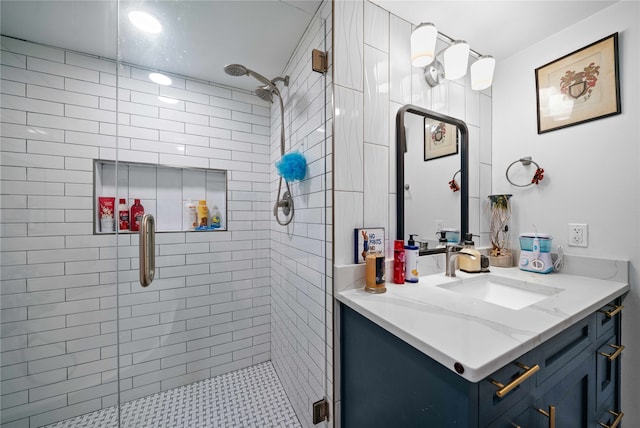 bathroom featuring tile patterned flooring, a shower with door, and vanity