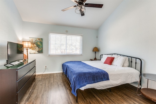 bedroom featuring ceiling fan, lofted ceiling, and hardwood / wood-style floors