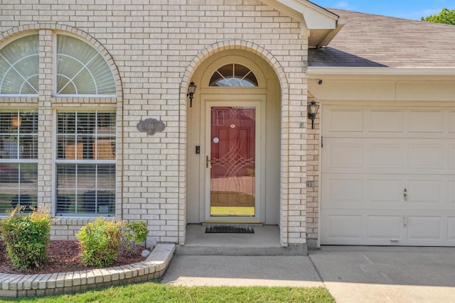 entrance to property featuring a garage