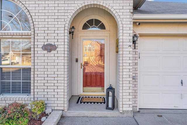 doorway to property featuring a garage