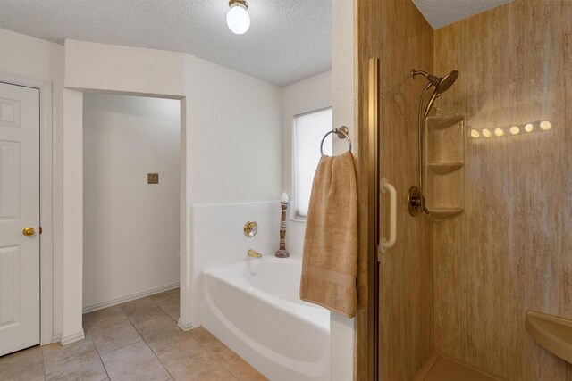 full bathroom featuring vanity, tiled shower / bath, a textured ceiling, and toilet