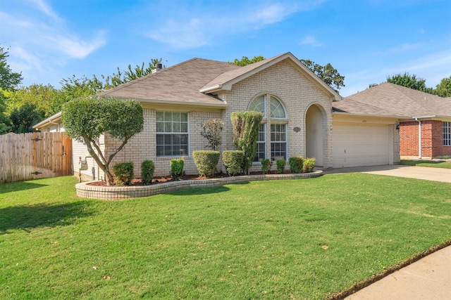 ranch-style home featuring a front lawn and a garage