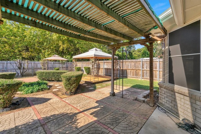 view of outbuilding with a yard, a gazebo, and an outdoor fire pit