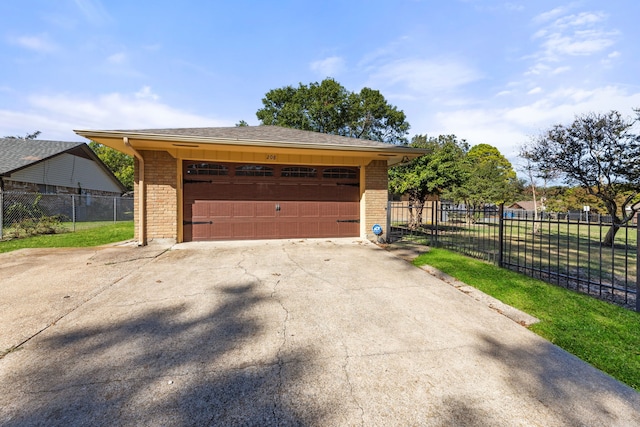 garage featuring a lawn