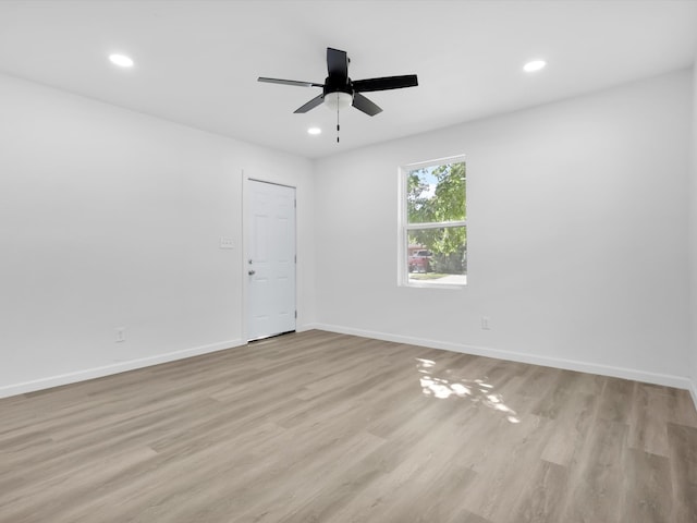 unfurnished room with ceiling fan and light hardwood / wood-style flooring