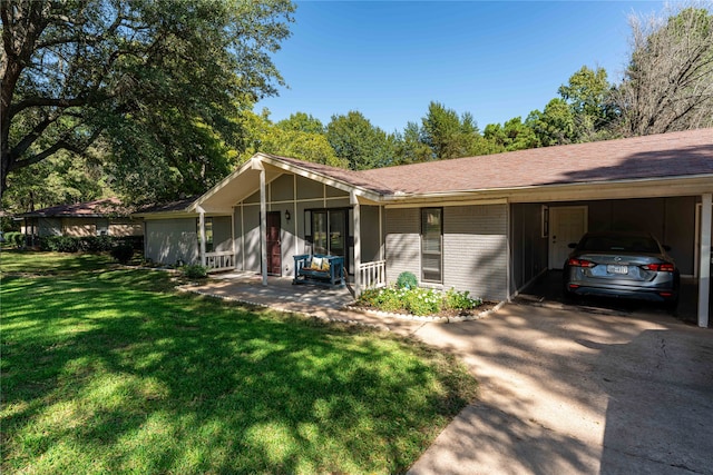 single story home with a front yard and a carport