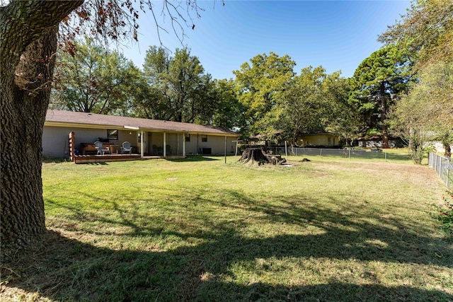 view of yard with a wooden deck