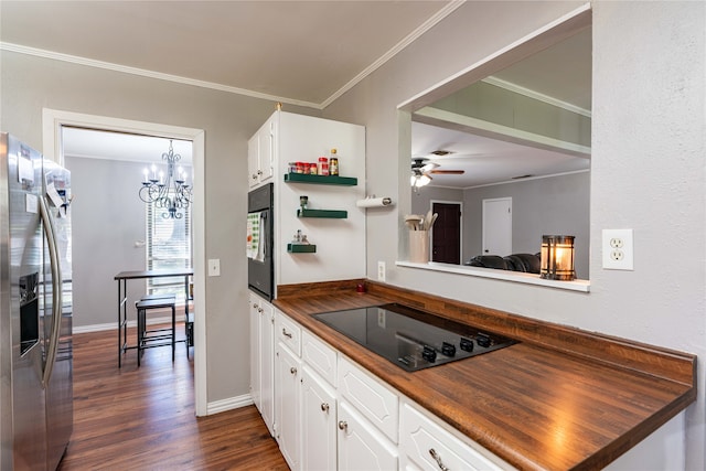 kitchen featuring white cabinets, dark hardwood / wood-style flooring, black appliances, crown molding, and wood counters