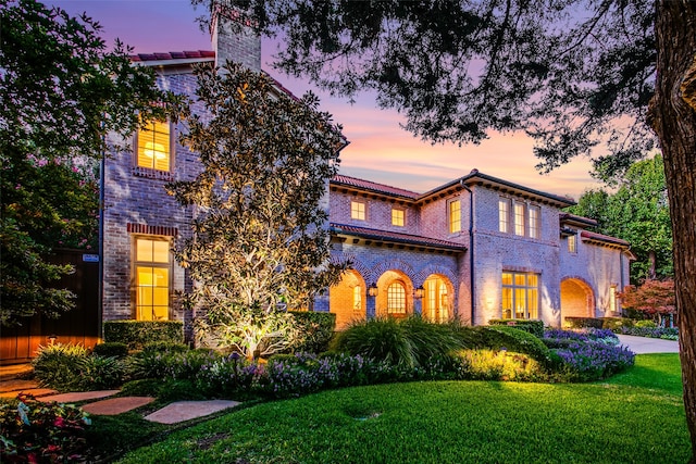 view of front of home with a lawn