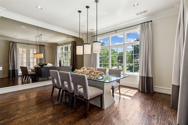 dining room featuring french doors, ornamental molding, plenty of natural light, and dark hardwood / wood-style floors