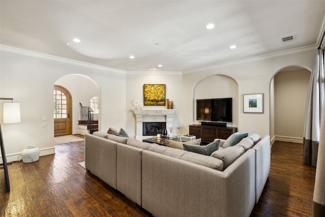 living room with ornamental molding and dark hardwood / wood-style flooring