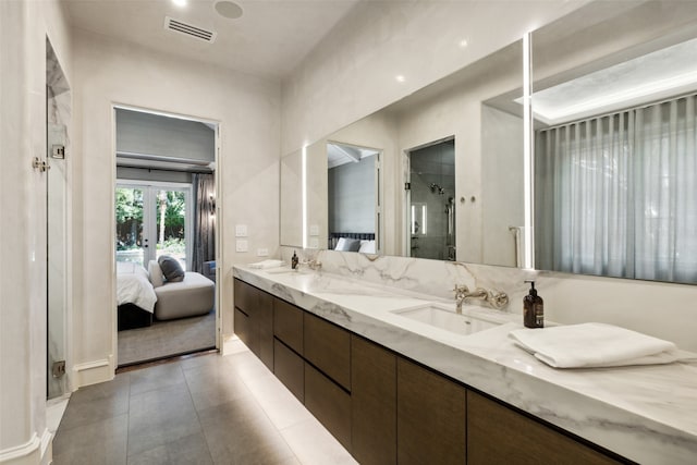 bathroom with walk in shower, french doors, tile patterned floors, and vanity