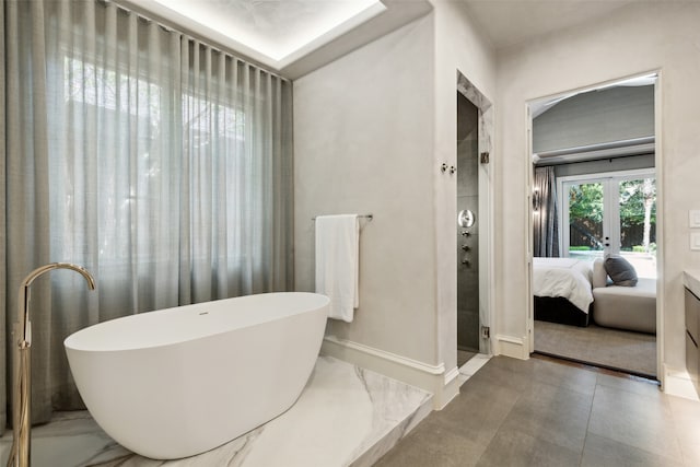 bathroom with separate shower and tub and french doors