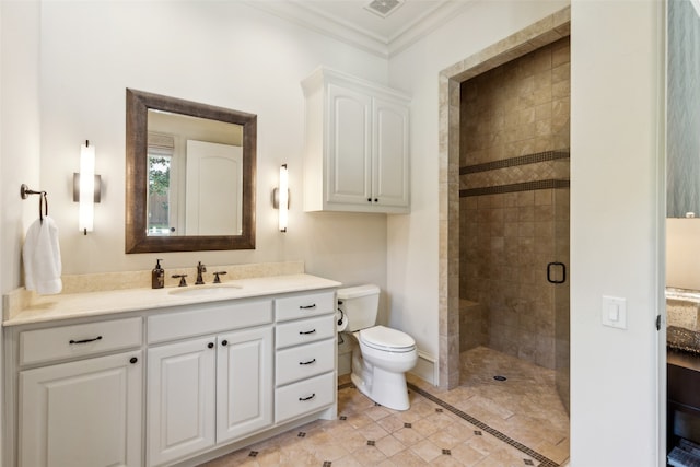 bathroom with crown molding, toilet, a shower with door, and vanity