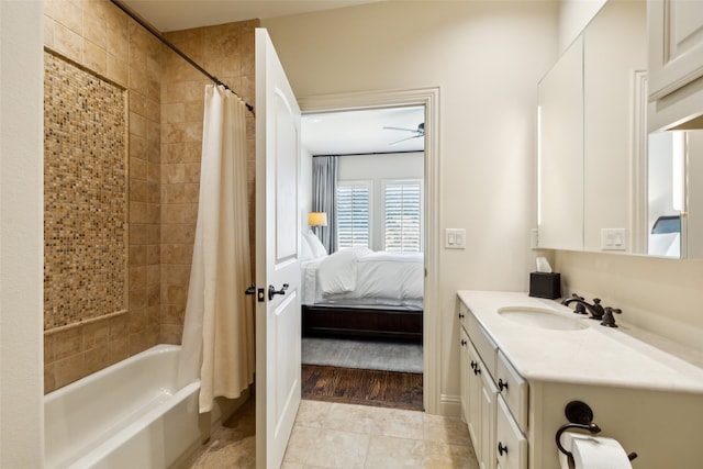 bathroom with ceiling fan, hardwood / wood-style flooring, shower / tub combo, and vanity