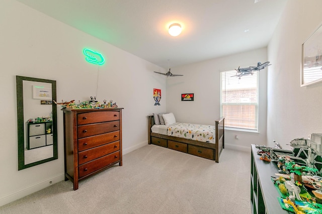 bedroom featuring light colored carpet