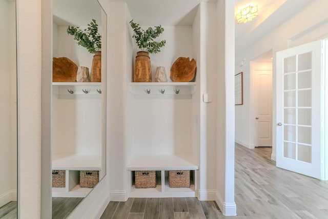 mudroom with wood-type flooring