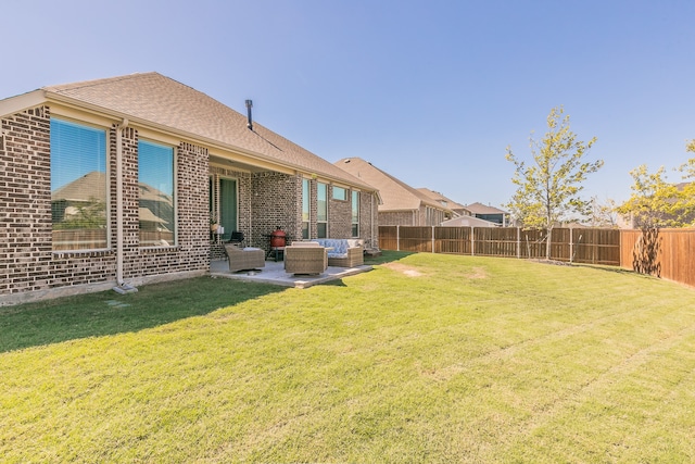 back of house with a yard, outdoor lounge area, and a patio