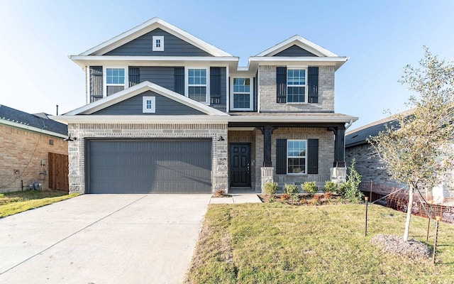 view of front facade with a front yard and a garage