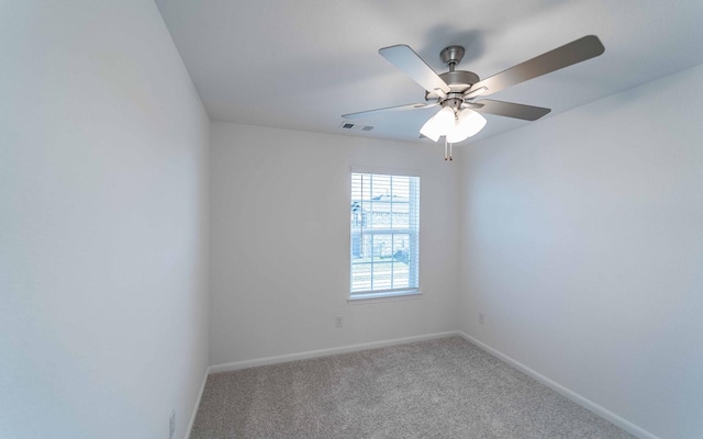 unfurnished room with ceiling fan and carpet floors