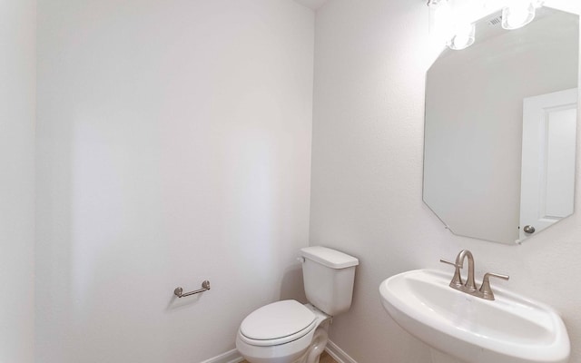 bathroom with toilet and sink