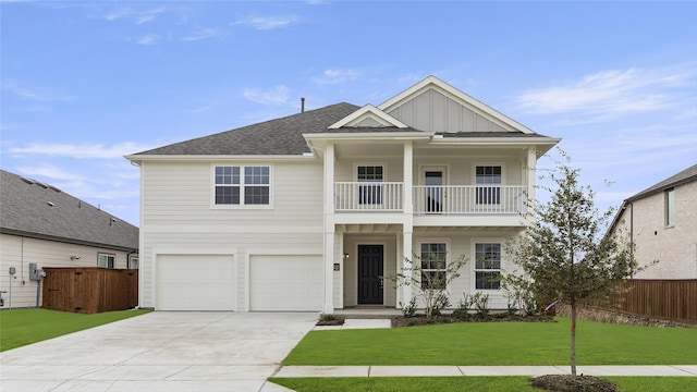 view of front facade featuring a front yard and a garage